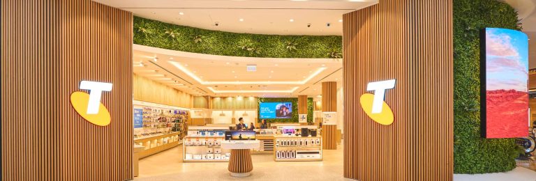 Telstra Chadstone facade with Telstra logo signage and curved LED and various digital screens